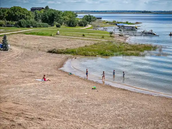 Sandy beach and shoreline trails along Lake Diefenbaker